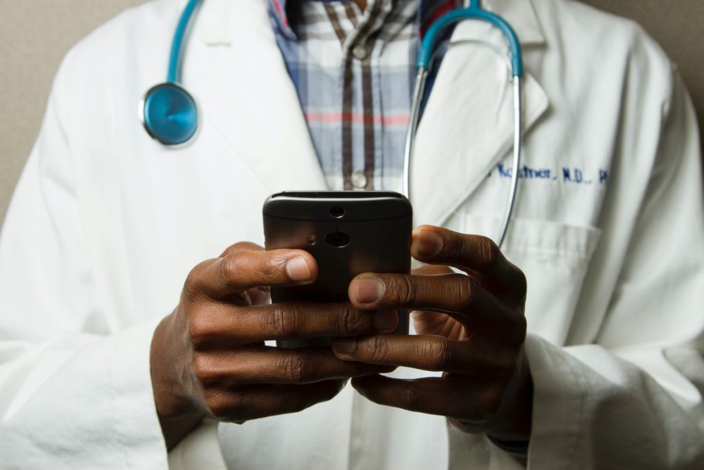 Doctor Holding Cell Phone What effect does your practice’s real estate have on its value?