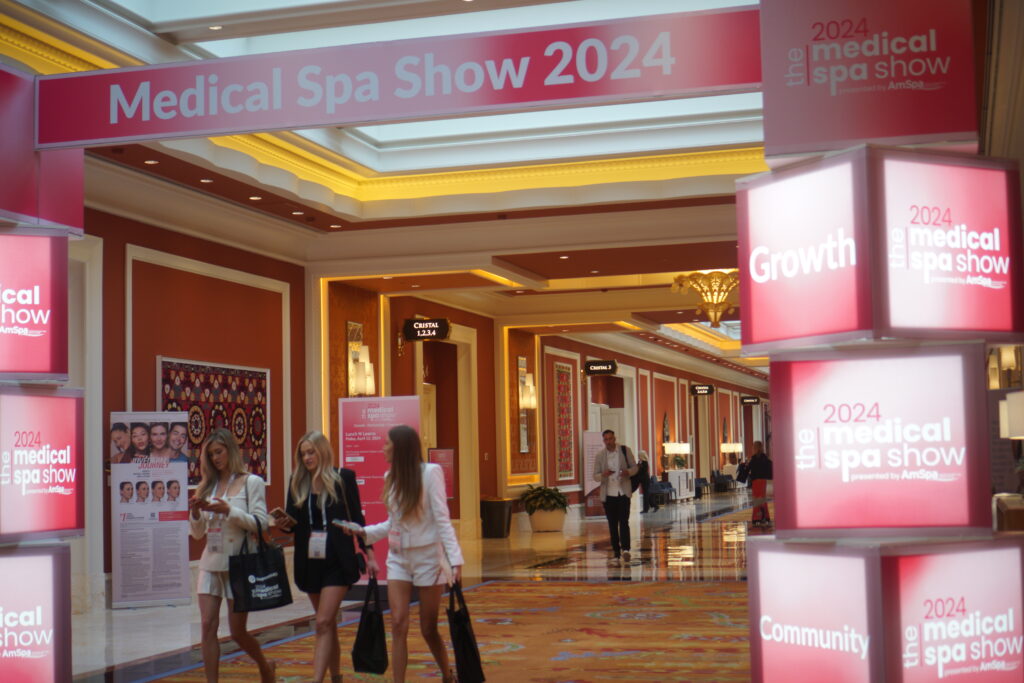 pink entryway display sign at amspa conference medical spa show 2024