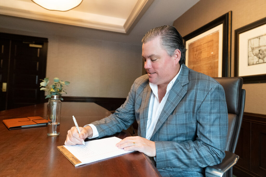 Advisor at Practice Transitions Group reviewing deal documents ahead of a behavioral health practice sale
