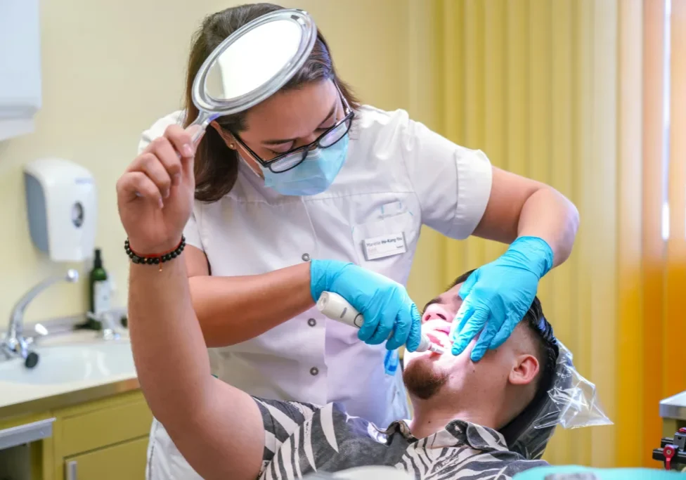 Dr. D was a seasoned dentist with a steady revenue but wanted a strategic partner to unlock the full potential of her practice. Having witnessed her father's missed opportunities in a previous dental practice sale without representation, she was driven to make informed decisions and refused to leave money on the table. https://unsplash.com/photos/a-man-getting-his-teeth-checked-by-a-dentist-zgYz8rCV6Aw?utm_content=creditShareLink&utm_medium=referral&utm_source=unsplash