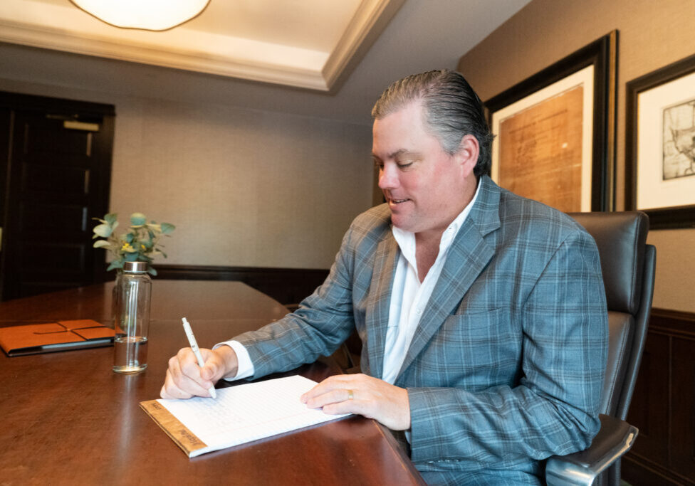 Advisor at Practice Transitions Group reviewing deal documents ahead of a behavioral health practice sale
